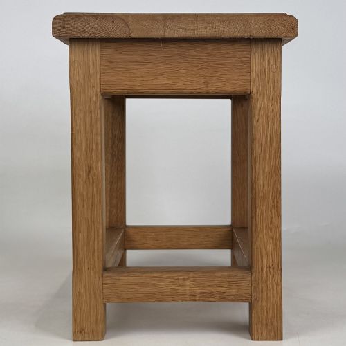 fig 2. A solid oak rectangular joint stool featuring visible wooden dowel joinery and a sturdy base with lower stretchers.