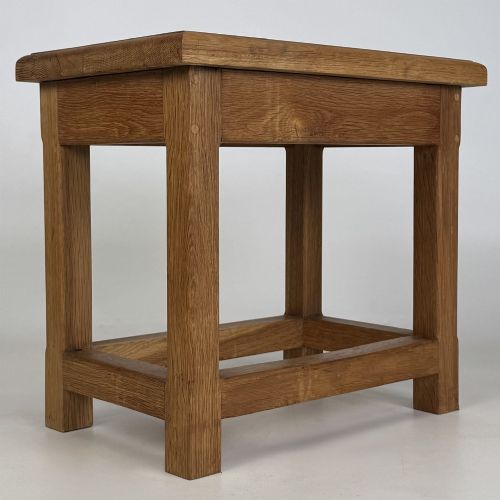 fig 3. A solid oak rectangular joint stool featuring visible wooden dowel joinery and a sturdy base with lower stretchers.
