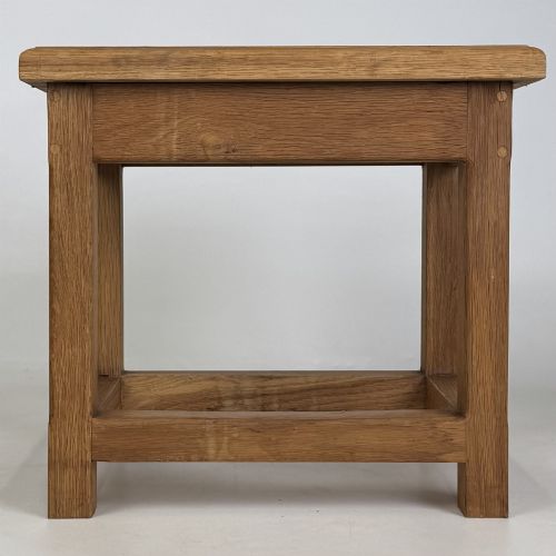 fig 4. A solid oak rectangular joint stool featuring visible wooden dowel joinery and a sturdy base with lower stretchers.