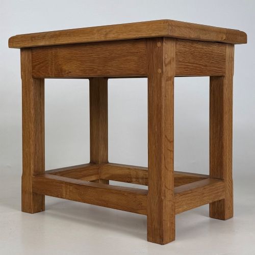 fig 5. A solid oak rectangular joint stool featuring visible wooden dowel joinery and a sturdy base with lower stretchers.