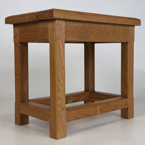 fig 7. A solid oak rectangular joint stool featuring visible wooden dowel joinery and a sturdy base with lower stretchers.