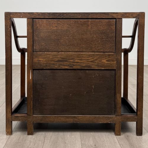 fig 4. An antique Edwardian golden oak hall seat featuring a central panelled backrest and integrated side umbrella stands with metal drip trays.