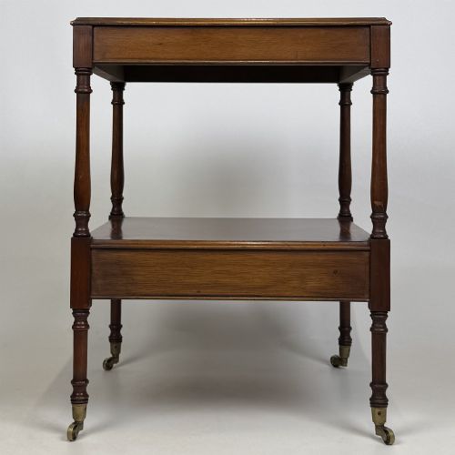 fig 5. A pair of 20th-century warm mahogany bedside tables featuring turned support pillars, open middle shelves, single lower drawers with brass handles, and brass castors.