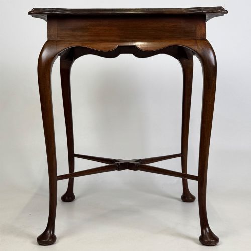 fig 2. An Edwardian mahogany side table featuring elegant cabriole legs, a shaped apron, and a central X-frame stretcher.