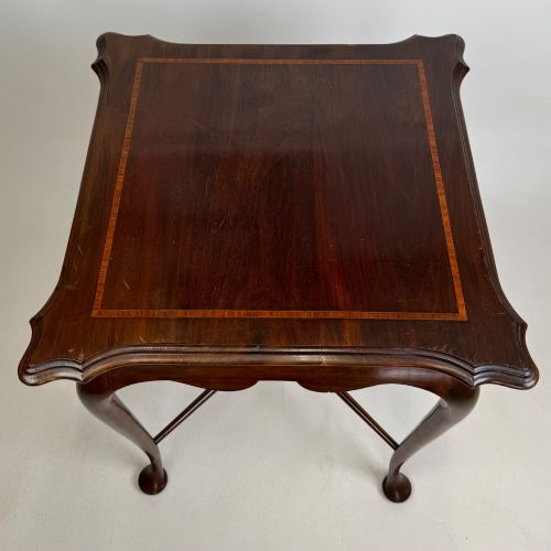 fig 8. An Edwardian mahogany side table featuring elegant cabriole legs, a shaped apron, and a central X-frame stretcher.