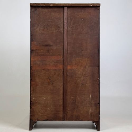 fig 5. A small Edwardian open bookcase crafted from dark oak timber featuring three open shelves and a shaped apron base.