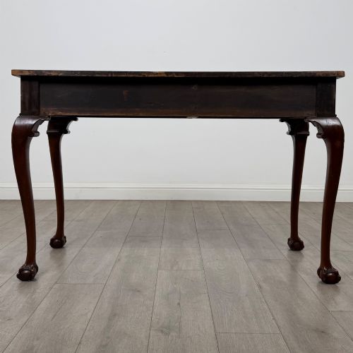fig 4. A 19th-century Chippendale style mahogany side table featuring carved cabriole legs ending in ball and claw feet.
