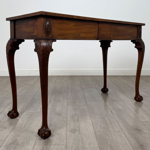 fig 7. A 19th-century Chippendale style mahogany side table featuring carved cabriole legs ending in ball and claw feet.