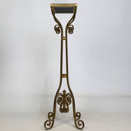 fig 1. A pair of tall gilded metal plant stands featuring incised leaf patterning, scrollwork legs, and square dark marble tops.