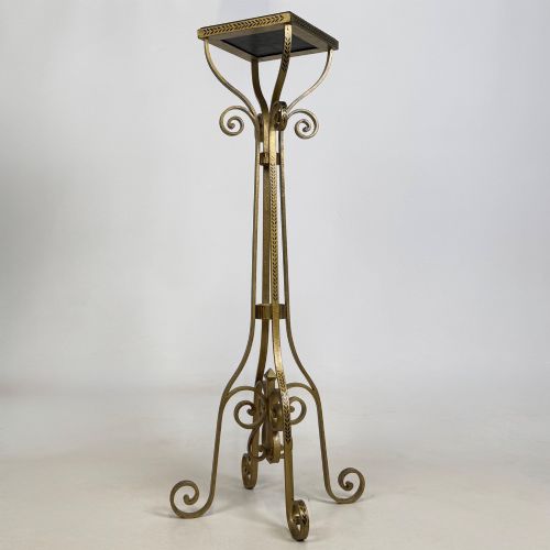 fig 2. A pair of tall gilded metal plant stands featuring incised leaf patterning, scrollwork legs, and square dark marble tops.