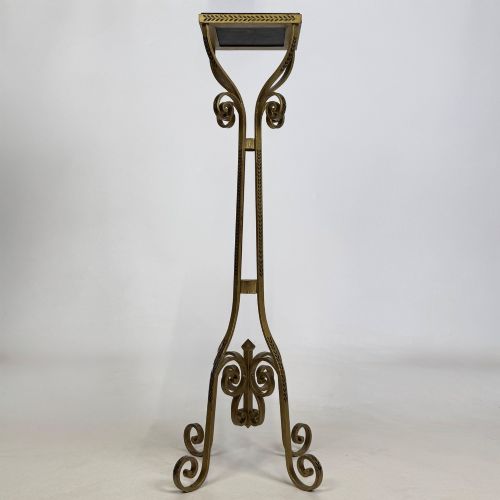 fig 5. A pair of tall gilded metal plant stands featuring incised leaf patterning, scrollwork legs, and square dark marble tops.