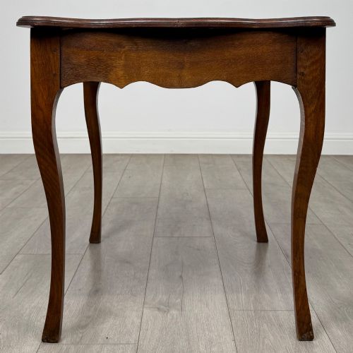 fig 2. A French provincial oak side table with curved cabriole legs and a scalloped apron.
