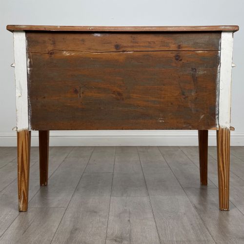 fig 5. A Victorian pitch pine cupboard featuring a single top drawer over two cupboard doors with diagonal timber panels and straight tapered legs.