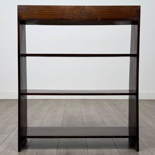 fig 5. A dark oak Edwardian open bookcase with four horizontal shelves holding leather-bound books.