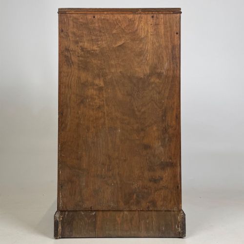 fig 5. A standing antique dark oak bedside cabinet with a single framed door, a round carved handle, and a solid plinth base.