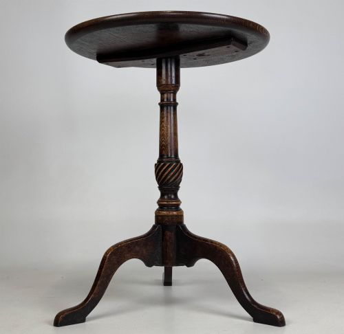 fig 1. A 19th-century dark oak circular side table featuring a turned pedestal with spiral carving on a tripod base.