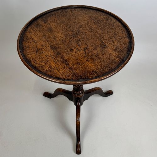 fig 2. A 19th-century dark oak circular side table featuring a turned pedestal with spiral carving on a tripod base.