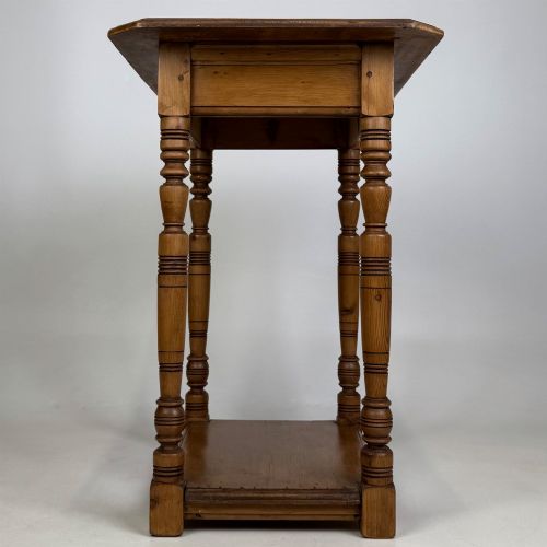 fig 2. A small 19th-century Victorian oak side table featuring turned legs, a rectangular top, and a lower shelf.