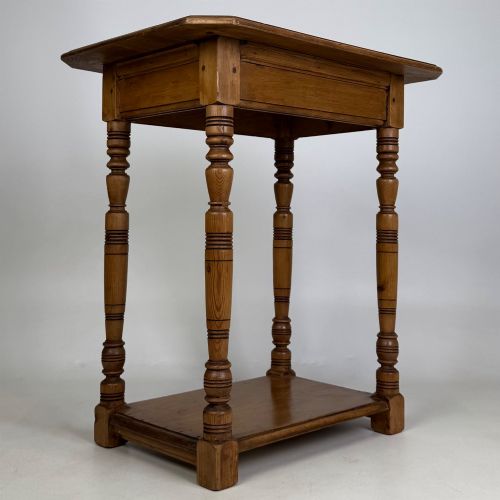 fig 3. A small 19th-century Victorian oak side table featuring turned legs, a rectangular top, and a lower shelf.