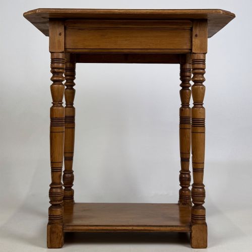 fig 4. A small 19th-century Victorian oak side table featuring turned legs, a rectangular top, and a lower shelf.