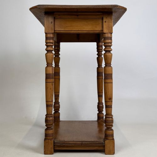 fig 6. A small 19th-century Victorian oak side table featuring turned legs, a rectangular top, and a lower shelf.