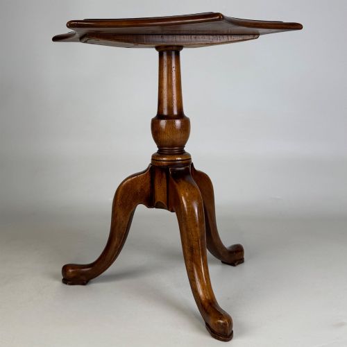 fig 1. A walnut tripod side table featuring a baluster-turned central pedestal, three splayed cabriole legs, and a shaped top.