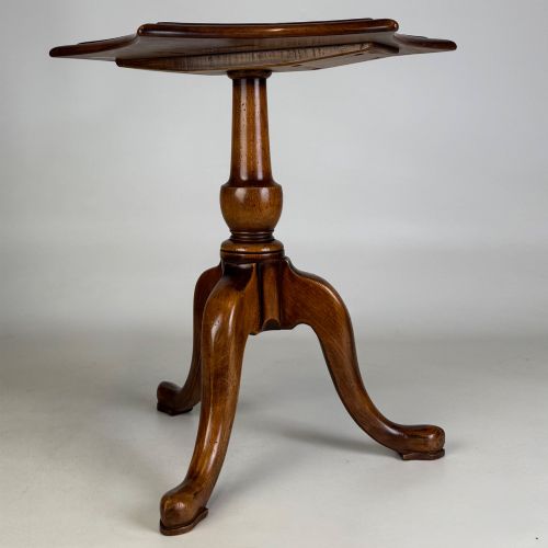 fig 3. A walnut tripod side table featuring a baluster-turned central pedestal, three splayed cabriole legs, and a shaped top.