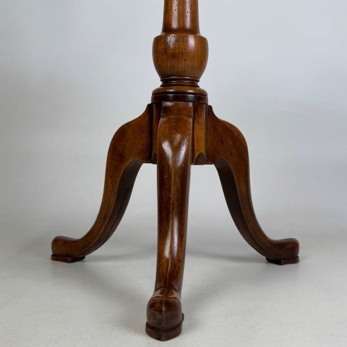 fig 5. A walnut tripod side table featuring a baluster-turned central pedestal, three splayed cabriole legs, and a shaped top.