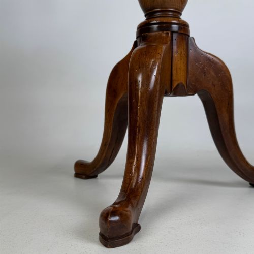 fig 6. A walnut tripod side table featuring a baluster-turned central pedestal, three splayed cabriole legs, and a shaped top.