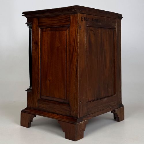 fig 5. A pair of matching mahogany bedside cabinets with single top drawers, panelled cupboard doors, and black ebonised side columns.