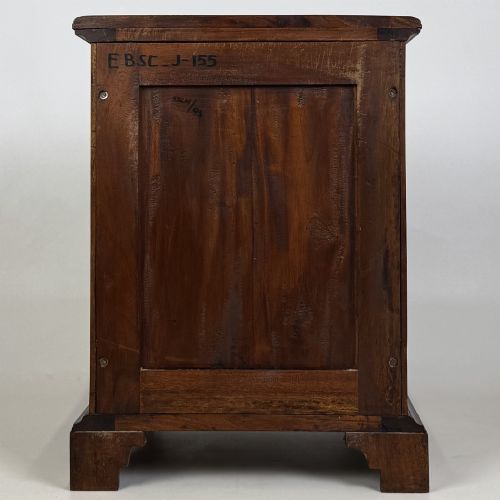 fig 6. A pair of matching mahogany bedside cabinets with single top drawers, panelled cupboard doors, and black ebonised side columns.