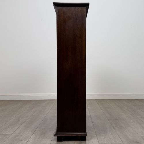 fig 3. An Edwardian open oak bookcase with four wide shelves and dark timber finish.