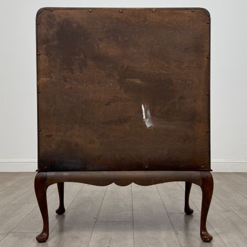 fig 5. An Edwardian figured walnut writing bureau featuring a slant front above three drawers and carved cabriole legs.