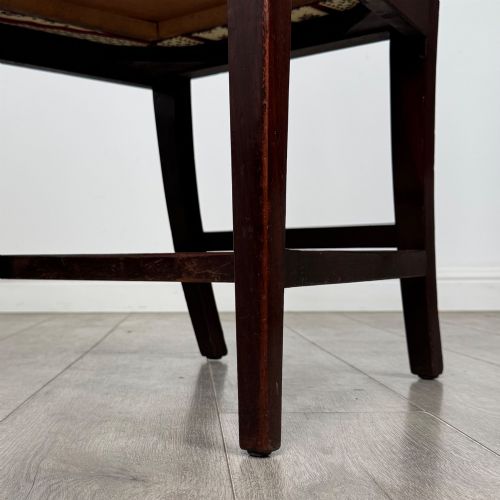 fig 6. A set of eight dark mahogany shield back dining chairs, including two carvers and six side chairs, with striped red and cream upholstery.