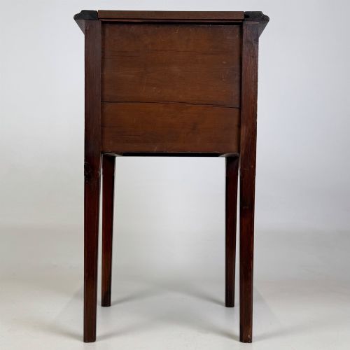 fig 4. A Victorian pitch pine cabinet with three drawers and black wooden knobs set on elevated tapered square legs.