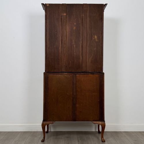 fig 6. An Edwardian oak bureau bookcase with a two-door upper glazed display cabinet, a sloping drop-front desk, three wide drawers, and cabriole legs.