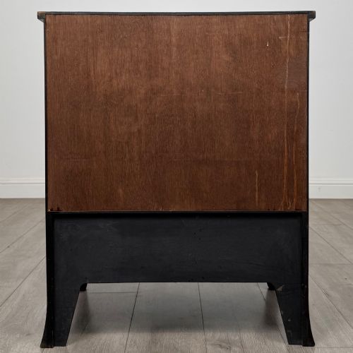 fig 5. A 20th-century mahogany serpentine cupboard featuring flame mahogany oval door panels, chevron veneering, a lower drawer with brass ring handles, and splayed bracket feet.