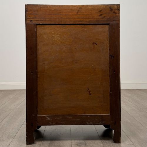 fig 5. An early 20th-century dark oak display cabinet featuring twin glazed doors, an interior shelf, and a gallery top.