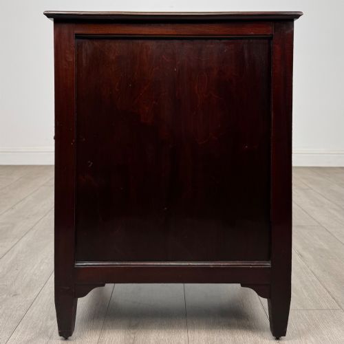 fig 3. A dark stained oak Edwardian cupboard featuring a single panel door, teardrop handle, and square tapered legs.