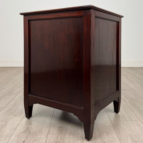 fig 4. A dark stained oak Edwardian cupboard featuring a single panel door, teardrop handle, and square tapered legs.
