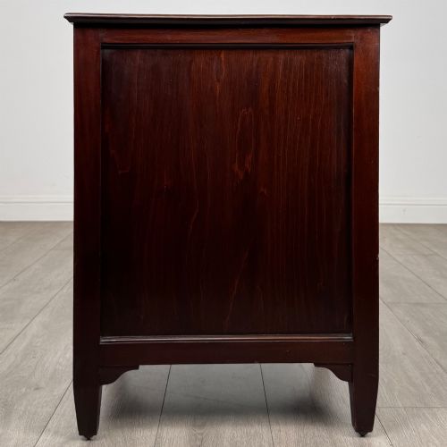 fig 7. A dark stained oak Edwardian cupboard featuring a single panel door, teardrop handle, and square tapered legs.