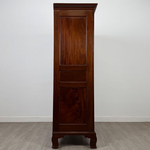fig 7. An 18th-century Georgian mahogany two-door wardrobe featuring fielded panel doors, a dentil-moulded cornice, and shaped bracket feet.