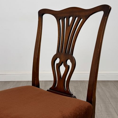 fig 3. A set of six dark wood Georgian style dining chairs featuring pierced splat backs and dark brown velvet upholstered seats.