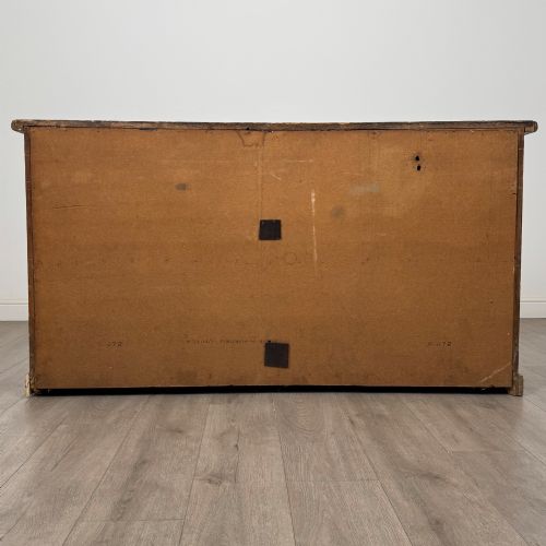 fig 5. A 19th-century pine farmhouse dresser base featuring three upper drawers above two cupboard doors and an open central shelf.