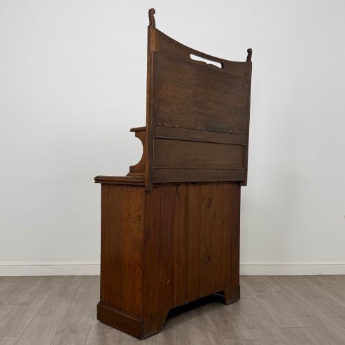 fig 4. An early 20th-century warm brown oak mirror back sideboard featuring two drawers, a double-door cupboard base, and an elevated mirror plate cresting.