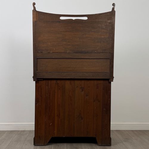 fig 5. An early 20th-century warm brown oak mirror back sideboard featuring two drawers, a double-door cupboard base, and an elevated mirror plate cresting.
