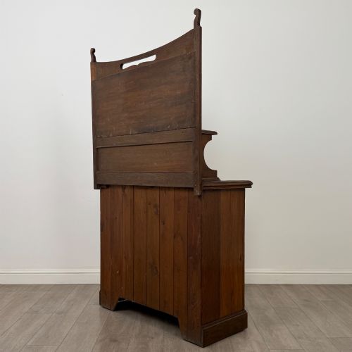 fig 6. An early 20th-century warm brown oak mirror back sideboard featuring two drawers, a double-door cupboard base, and an elevated mirror plate cresting.