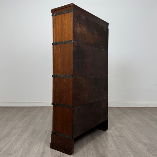 fig 4. An early twentieth-century oak four-tier Globe Wernicke stacking bookcase featuring glazed lift-and-slide doors.