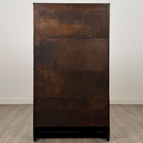 fig 5. An early twentieth-century oak four-tier Globe Wernicke stacking bookcase featuring glazed lift-and-slide doors.