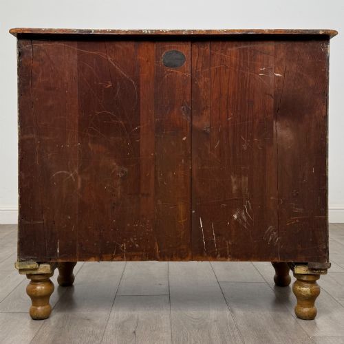 fig 4. A Victorian pine chest of drawers featuring a two over two drawer layout, turned wooden knobs, and turned feet.